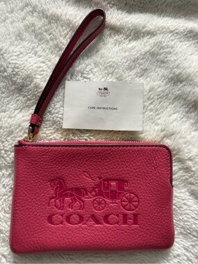 Like New Coach Pink Pebbled Leather Wristlet with Embossed Logo